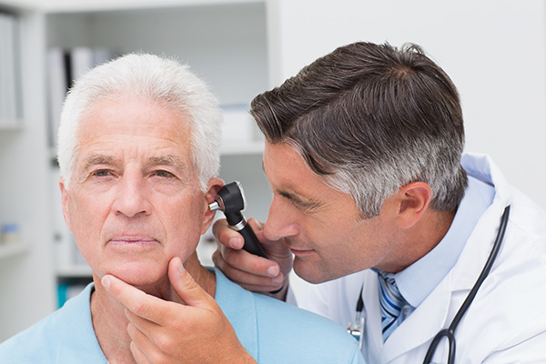 Audiologist looks for hearing damage